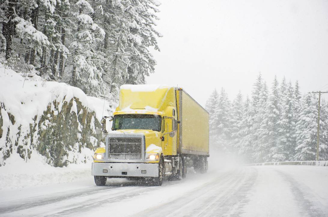 A yellow truck driving on a snowy road

AI-generated content may be incorrect.